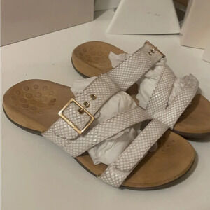 Voinic soft cream color sandals with Velcro to adjust the size.
